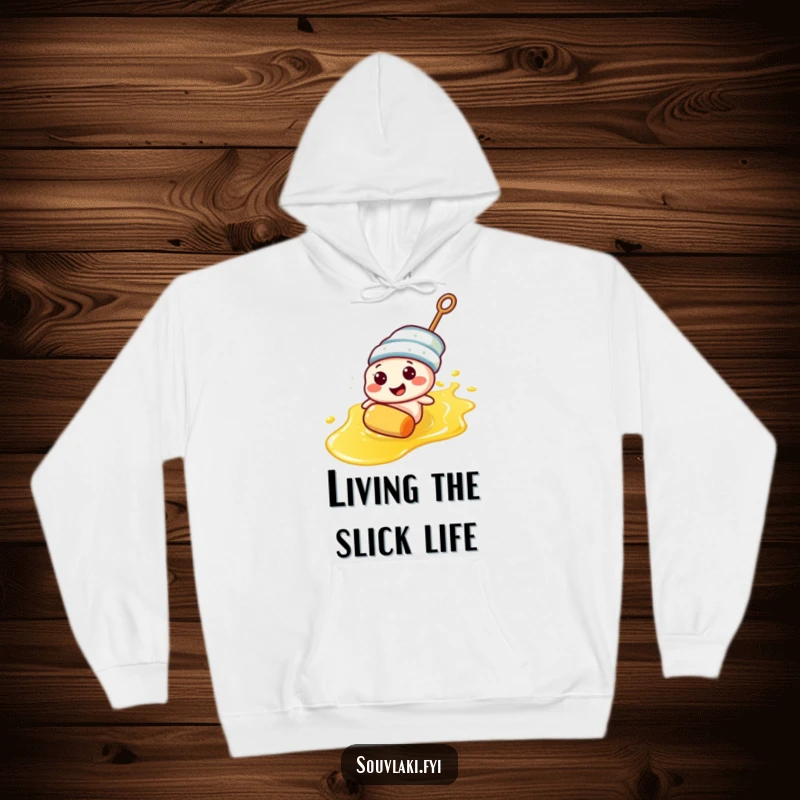 Funny souvlaki skewer character enjoying a humorous slide down olive oil on a hoodie, perfect for cozy laughs.